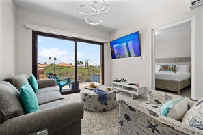 An air-conditioned living room with TV.
