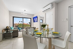A view of the living room and dining room area.