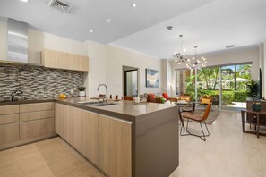 This stylish kitchen offers everything you need, from modern appliances to ample counter space, making it perfect for preparing meals during your stay.