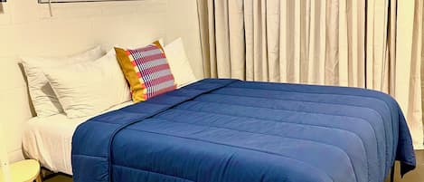 Comfy queen bed for work or rest. Freshly washed linens every stay.