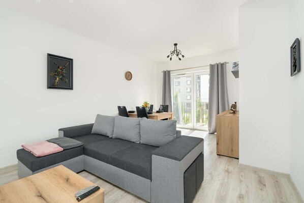 Bedroom with corner sofa.