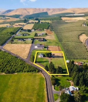 Aerial view of our 1910 Farmhouse and the surrounding orchards and vineyards.