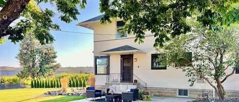 The side door yard and patio is the main yard and access to our Farmhouse.