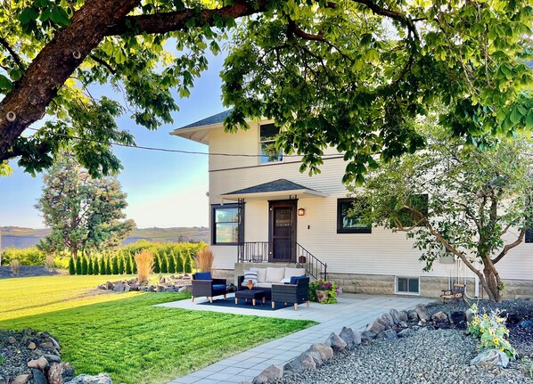 The side door yard and patio is the main yard and access to our Farmhouse.