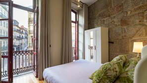 Wake up to charming views of Porto’s historic architecture from your cozy and elegant bedroom. Enjoy natural light streaming through large windows. #Bedroom #Bright