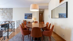 Enjoy meals with family and friends in this stylish dining area, featuring a spacious oval table and chic, comfortable chairs. The warm lighting and tasteful decor create the perfect ambiance for intimate dinners or casual gatherings. #Dining #Airbnb