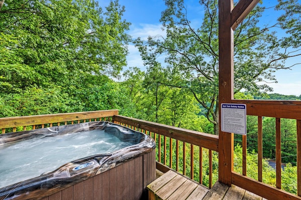 The lower porch also has the hot tub, a great place to enjoy the stars at night!