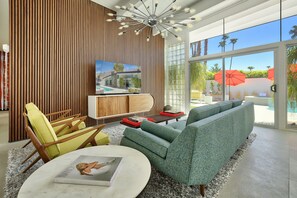 A cozy family/TV room area with vintage inspired furniture 