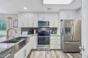 New sunny kitchen with all of the essentials. Dining-in options made easy.