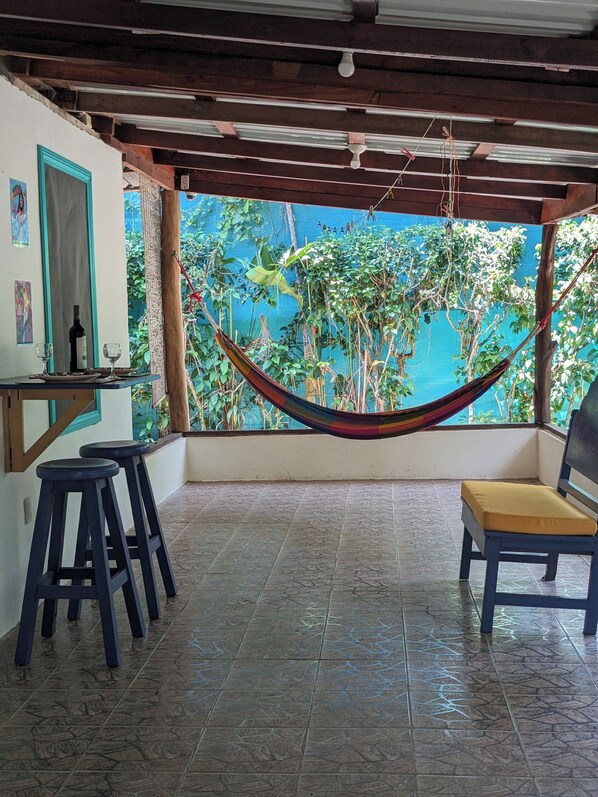 Outdoor dining/living area with hammock
