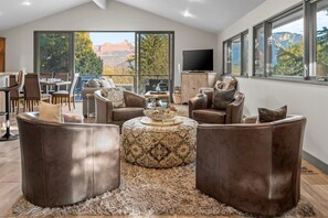 Welcome to our inviting rustic living room with stunning mountain vistas