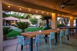 Illuminated by string lights, creates a magical ambiance for your evening meals