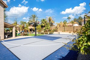 Welcome to our expansive sports court—where you can shoot hoops on the basketball court or perfect your serve on the tennis court. Game on!