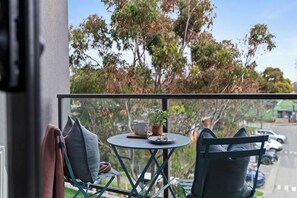 A balcony. *(Chairs in photos are from the dining area).