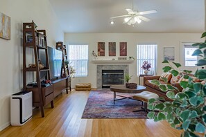 Walk into the open concept living room with 65" Smart TV