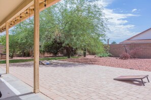 Spacious, private backyard with Cornhole