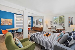 Additional living space with dining table, desk space, and sofa sleeper 