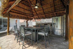 Take advantage of our warm weather and use this outdoor kitchen and dining area to enjoy a tasty al fresco meal. The BBQ, sink, and fridge make it easy to whip up a tasty meal!