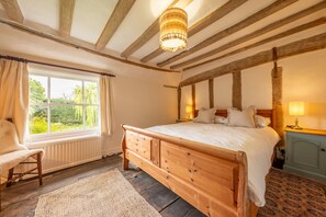 First floor: Bedroom three with king-size bed