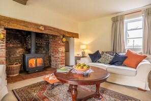 Cutbush Farm House, Hingham: Sitting room with wood burning stove