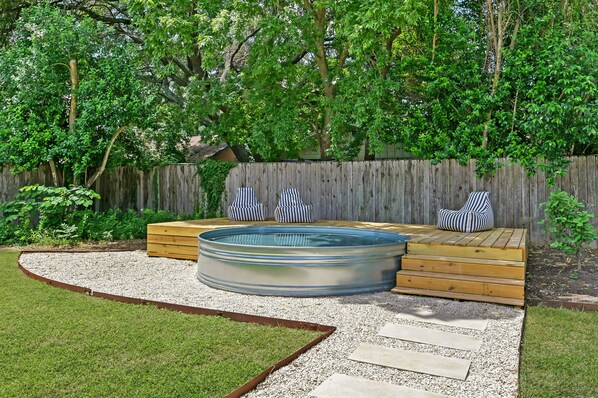 Our cowboy pool offers a refreshing way to cool off in the summer while soaking up the sun, making it a perfect spot for swimming and enjoying fun moments outdoors.