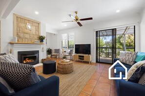 Living area which opens onto the front deck of the property