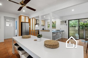 Open plan living, kitchen with dining table for eight