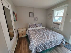 A comfy bed and a window that brings nature in, what more could you ask for?