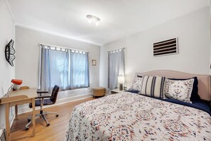 This comfortable queen bedroom will give you peaceful slumber each night of your stay.This room  also has a small work space.
