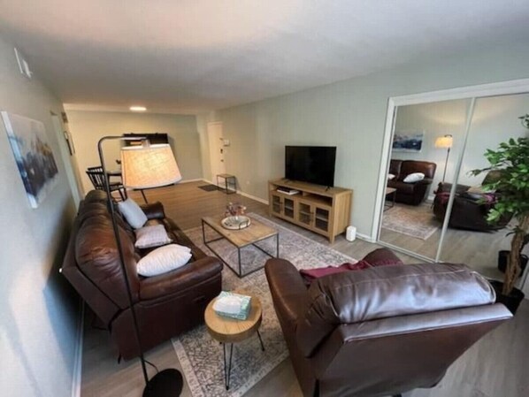 Imagine unwinding in this stunning living room, where every piece of furniture tells a story.