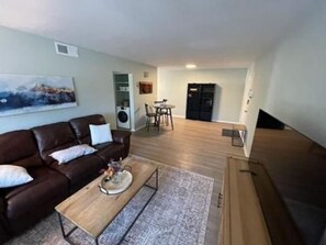 Embrace comfort and style with the perfect furniture arrangement and a stunning  flat screen Tv.