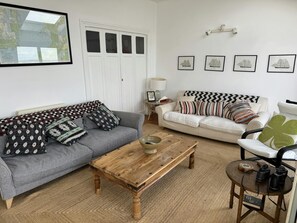 First floor living room with two sofas and coffee table