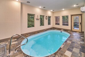 Enjoy a private indoor heated pool, perfect for year-round relaxation! This climate-controlled space offers ultimate comfort, whether you're unwinding after a day of adventure or having fun with family and friends. A luxurious feature for all seasons