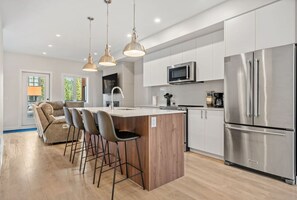Full kitchen with all the necessities plus a blender, crockpot/slow cooker & griddle.