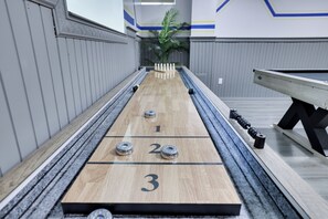 Enjoy a classic game of shuffleboard in our game room downstairs!