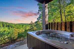 Hot tub fits 4, has jets, lights, and mountain views. Pool towels provided