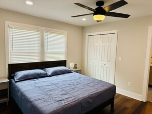 Bedroom 1 with ensuite shower bathroom, Nectar King bed mattress, closet space, 43 in Smart TV and desk/desk chair.