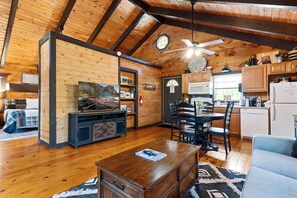 Relax beneath vaulted ceilings in the warm, wood-toned living space. Curl up with a book or stream your favorite show after a day of hiking or exploring town.