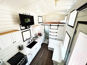 Full kitchen with sink, stove, refrigerator, coffee maker, and a great view