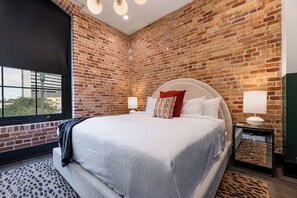 Retreat to the Primary bedroom with a plush king bed, walk-in closet, blackout shades, and a smart TV. Designed for comfort and privacy, this suite is perfect for recharging after a day exploring New Orleans.