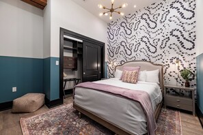 The second bedroom offers a cozy queen bed, dresser, smart TV, and soft linens. Great for families or friends traveling together, this room combines comfort and privacy in the heart of Downtown New Orleans.