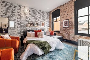 Relax in the living area with a smart TV, stylish seating, and a queen-sized sleeper sofa for extra guests. Perfect for families or group stays in New Orleans, this inviting space is ideal for movie nights or recharging after a day in the city.