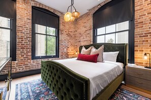 Retreat to the Primary bedroom with a plush king bed, walk-in closet, blackout shades, and a smart TV. Designed for comfort and privacy, this suite is perfect for recharging after a day exploring New Orleans.