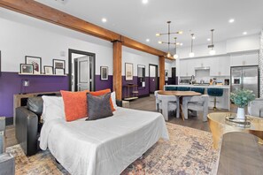 Relax in the living area with a smart TV, stylish seating and a sleeper sofa for extra guests. Perfect for families or group stays in New Orleans, this inviting space is ideal for movie nights or recharging after a day in the city.