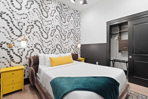 The second bedroom offers a cozy queen bed, dresser, smart TV, and soft linens. Great for families or friends traveling together, this room combines comfort and privacy in the heart of Downtown New Orleans.
