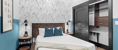 The second bedroom offers a cozy queen bed, dresser, smart TV, and soft linens. Great for families or friends traveling together, this room combines comfort and privacy in the heart of Downtown New Orleans.