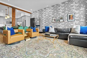 Relax in the living area with a smart TV, stylish seating, and a sleeper sofa for extra guests. Perfect for families or group stays in New Orleans, this inviting space is ideal for movie nights or recharging after a day in the city.