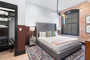 Retreat to the Primary bedroom with a plush king bed, walk-in closet, blackout shades, and a smart TV. Designed for comfort and privacy, this suite is perfect for recharging after a day exploring New Orleans.