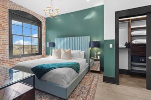 Retreat to the Primary bedroom with a plush king bed, walk-in closet, blackout shades, and a smart TV. Designed for comfort and privacy, this suite is perfect for recharging after a day exploring New Orleans.