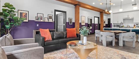 Relax in the living area with a smart TV, stylish seating, and a sleeper sofa for extra guests. Perfect for families or group stays in New Orleans, this inviting space is ideal for movie nights or recharging after a day in the city.